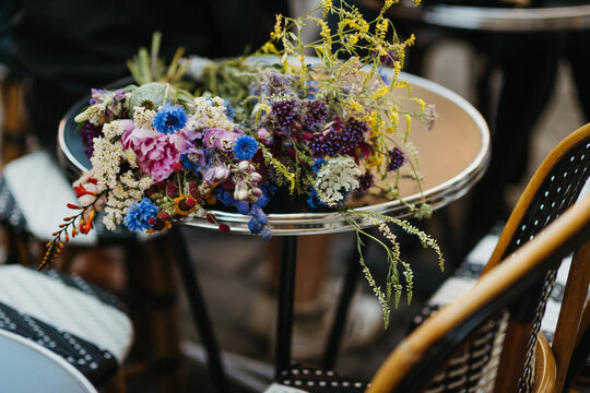 wild flowers on a bistro table in Paris