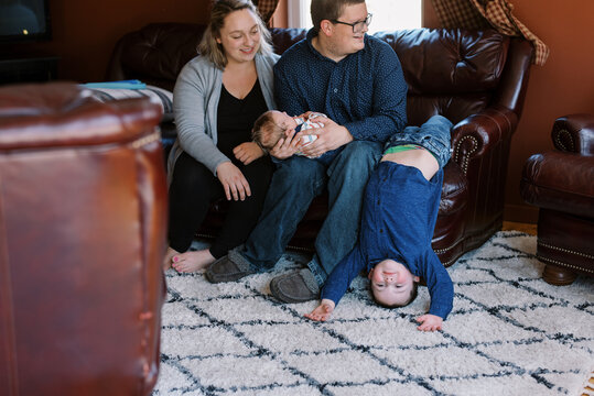 laughing upside down toddler at home being tickled