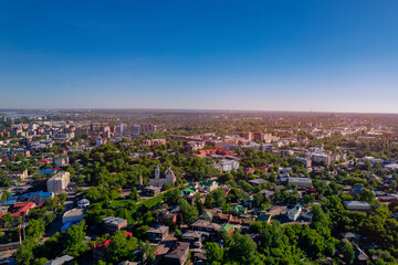 Summer panorama city Tomsk and Tom River with sunlight. Aerial top view from drone