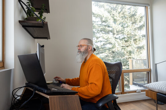 Working On Computer In Home Office