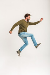 handsome bearded stylish man jumping running