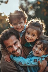 A father or guardian holding two young kids close to him, possibly in a moment of comfort and protection
