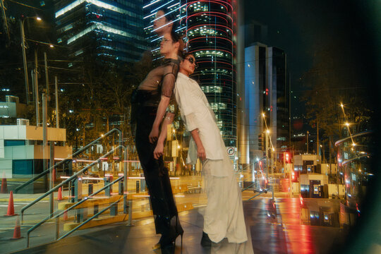 Contrasting duo in cityscape reflections