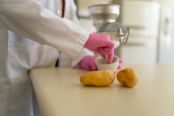 Unrecognizable chemist preparing sample for experiment in laboratory