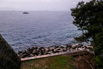 Boat in View on Miramare castle on the gulf of Trieste on northeastern Italy. Long exposure image...