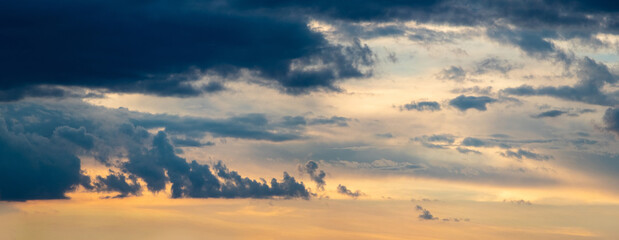 Evening sky with dark blue clouds