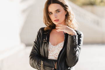 attractive woman walking in street in fashionable outfit