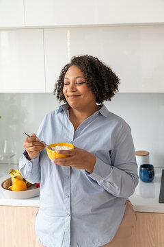 Content Woman Enjoying Yogurt