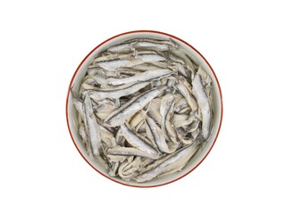 Marinated anchovy fillets in a ceramic bowl on white background. Top view.