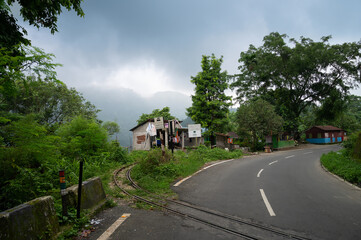 Darjeeling,West Bengal,India - 10th August 2023 : Beautiful roadside village. Natural beauty. Himalayan mountains and monsoon clouds in the background.