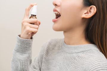Health care treatment sore throat concept, sick pain asian young woman have cough symptom holding...