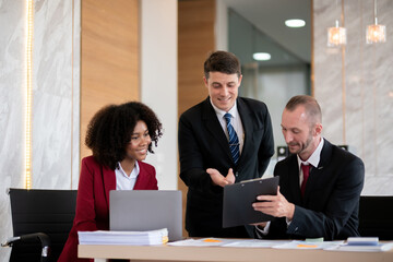 Diverse business team collaborating at office desk, Concept of teamwork