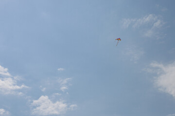 Colorful Kite Flying in Clear Sky