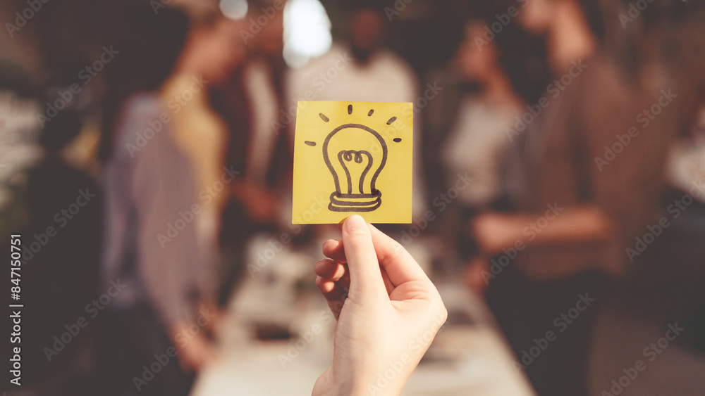 Poster new idea concept. business team discussing startup project, picture of light bulb on foreground