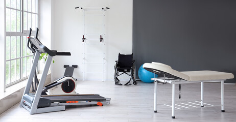 Interior of rehabilitation center with couch and equipment