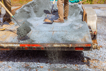 During leveling of driveway, workers filled parking lot near house with small stones