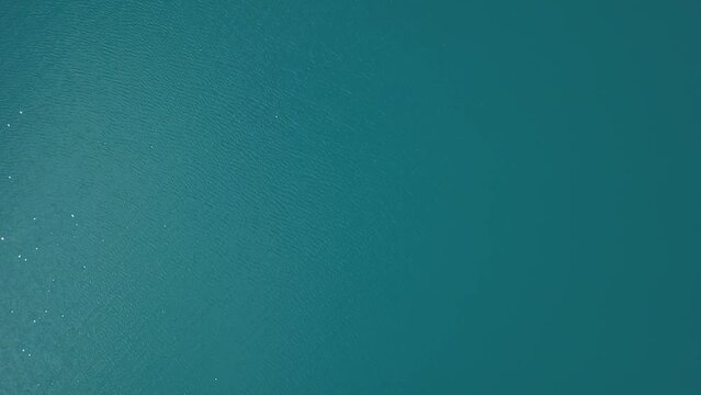 Aerial View of Turquoise Waters Surrounded by Verdant Greenery and Tranquil Nature