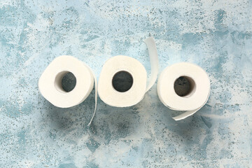 Rolls of toilet paper on blue background