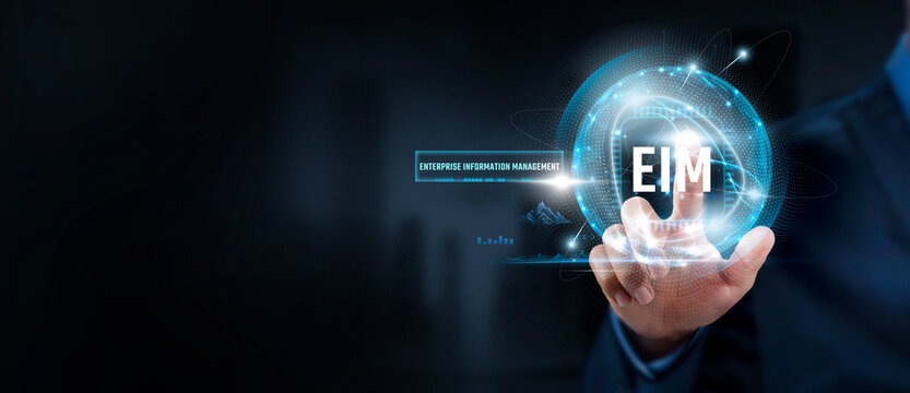 EIM Businessman Touching Enterprise Information Management (EIM) Icon and Global Network. Efficiency, Integration.
