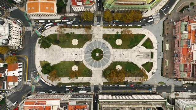 Plaza de Mayo (Buenos Aires, Argentina) with people walking. Top view aerial camera descends from high altitude to the central circle