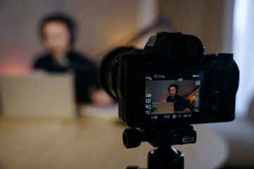 The podcaster is shooting a video