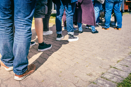 Long queue of people waiting in line