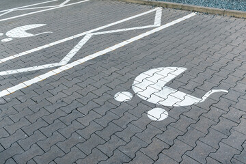 A parent and child parking sign on empty public parking lot, reserved for family with kids