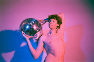 Attractive man with disco ball