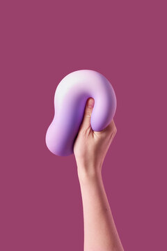 Person holding soft violet plasticine symbolizing coping with anxiety