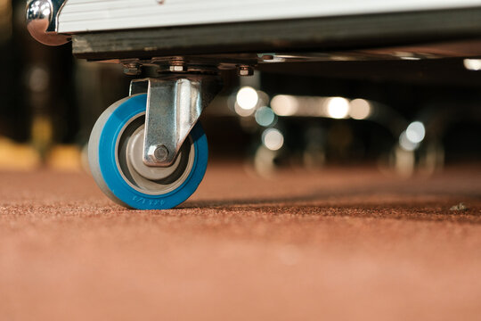 Blue castor roller wheel with metal support in light