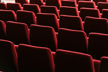 Rows of red seats in cinema theater