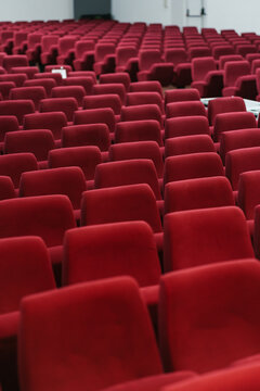 Spacious modern conference hall with red empty seats