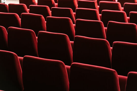 Rows of red seats in cinema theater