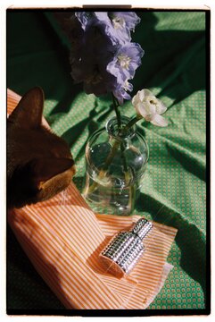 A silver perfume bottle on the table