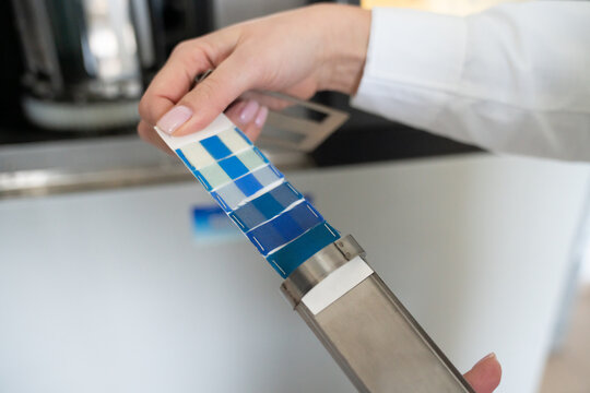 Scientist Hand Holding Fading Lamp Filter