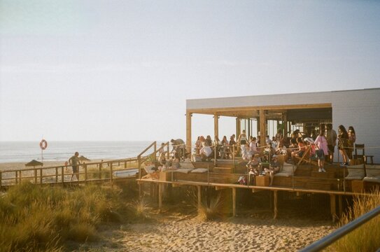Summer beach party vibes in cafe bar in Portugal, 35mm film