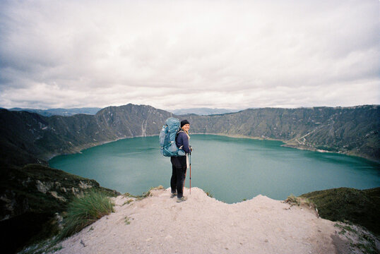 Volcanic lake woman standing 