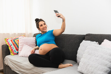 Pregnant woman relaxing in sofa