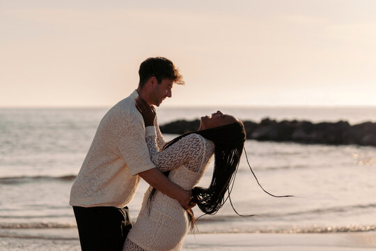 Happy couple in love laughing and having fun
