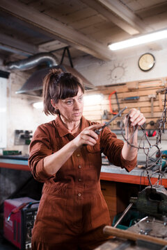 Female iron sculpture effort at work
