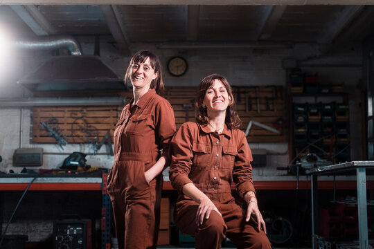 Cheerful metal workshop partners