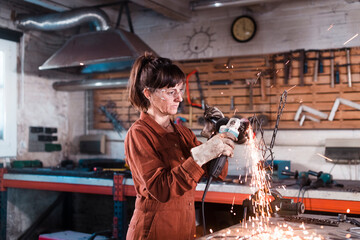 Metal artist creating artwork using angle grinder