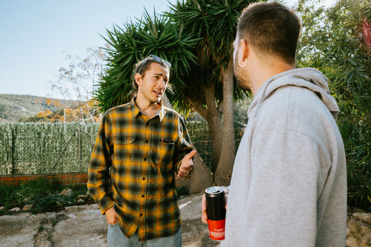 Casual Conversation Outdoors Between Friends