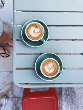 two perfect flat white coffees flat lay