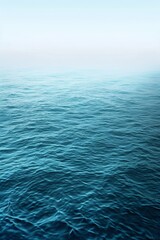 Naklejka premium Calm Blue Ocean Water On A Cloudy Day