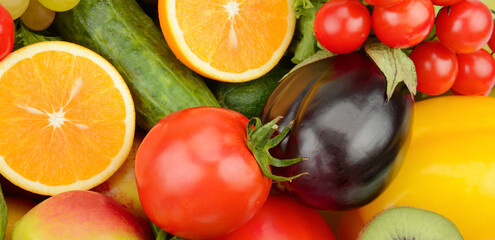 Assorted fresh ripe fruits and vegetables. Food background. Wide photo.