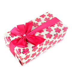 A gift in festive packaging isolated on white.