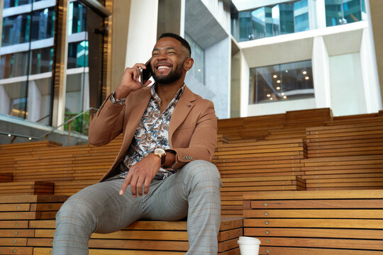 Confident smiling business man in city of Melbourne 