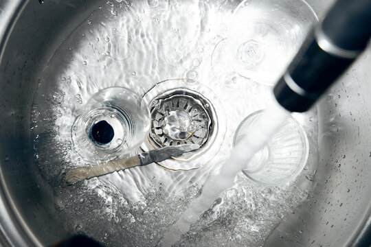 Water pours into the sink