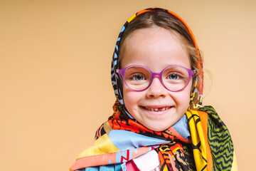 Smiling Child in Colorful Accessories